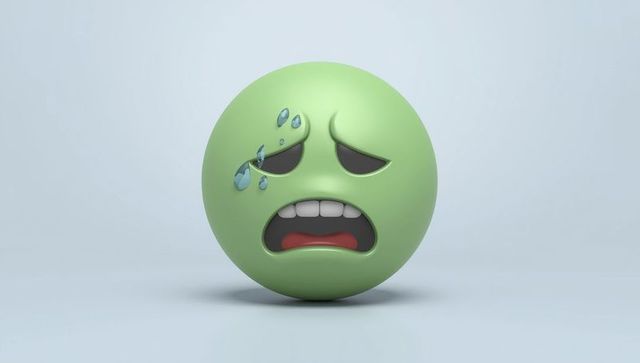 3d sick green emoji with tears illustrating discomfort