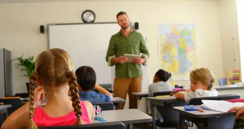 Diverse classroom learning with male teacher