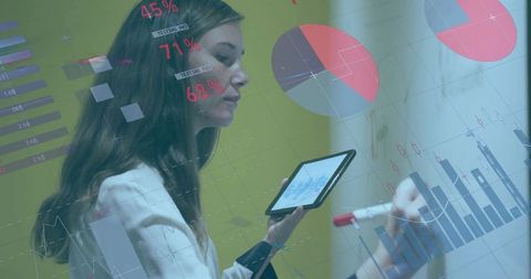 Business Analyst Writing Data Charts on Glass Board