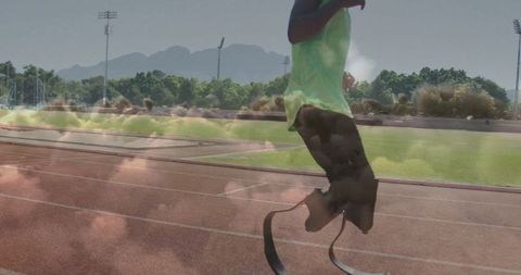 Teen Athlete Running with Carbon-Fiber Blades on Track