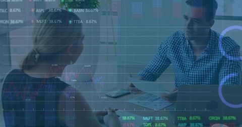 Colleagues Strategizing on Stock Market Analysis in Modern Office