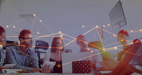 Diverse Business Team Analyzing Digitized Network Data in Office