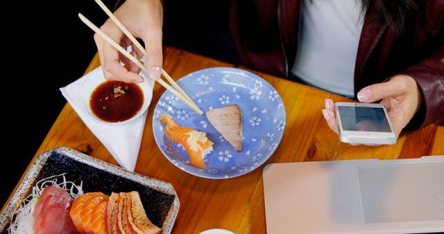 Person Eating Sushi While Using Smartphone - Download Free Stock Images Pikwizard.com