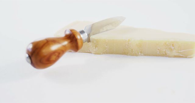 Cheese Knife with Wooden Handle and Parmesan Cheese Wedge - Download Free Stock Images Pikwizard.com