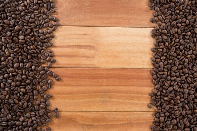 Close-up of coffee beans arranged on wooden table
