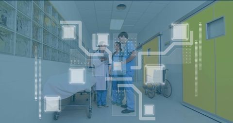 Health Professionals Analyzing Digital Interfaces in Hospital Corridor