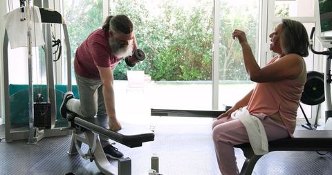Senior Couple Relaxing with Smoothies Post Workout