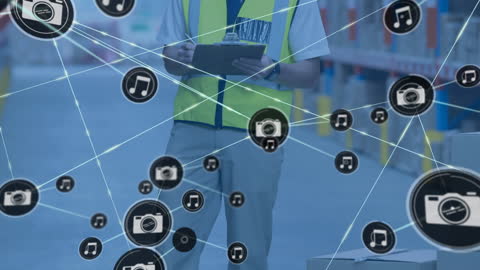 Warehouse Worker Examining Inventory with Digital Icons Overlay