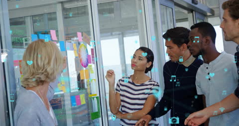 Diverse Team Collaborating on Strategic Planning with Technology