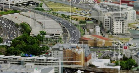 Aerial highway interchange with digital data visualization overlay