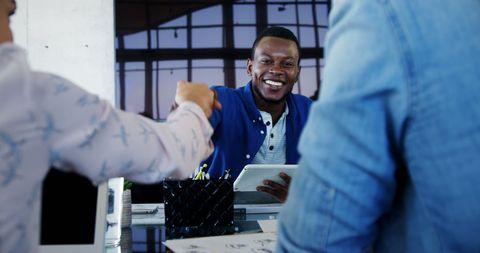 Happy Businessman Handshake in Modern Office Setting