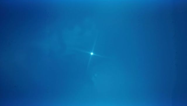 Sleek abstract glowing light with star lens flare effect