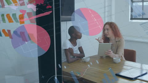 Diverse Colleagues Analyzing Data with Tablet in Modern Office