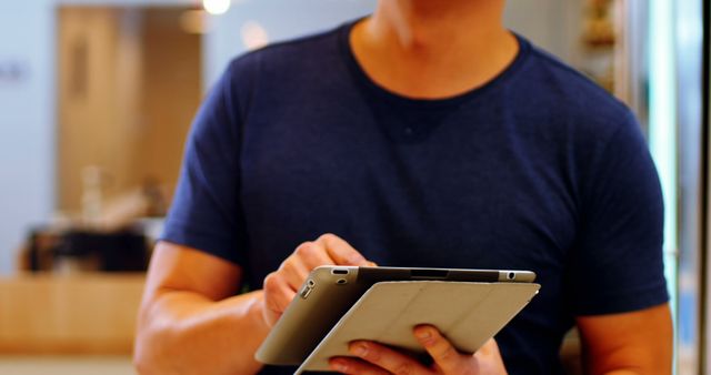 Person in Blue Shirt Using Tablet in Modern Office - Download Free Stock Images Pikwizard.com