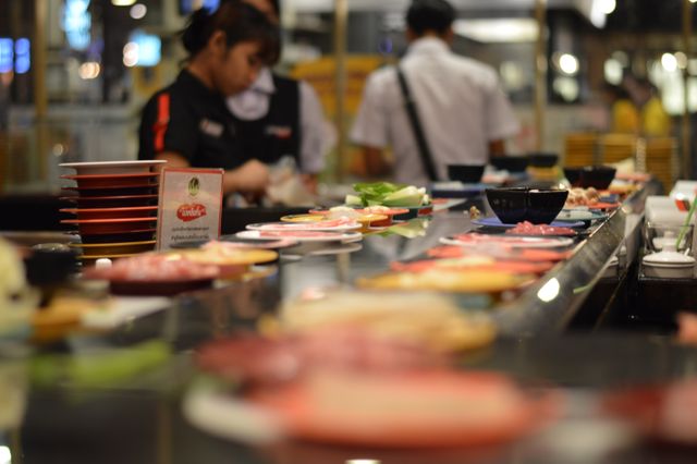 Sushi Conveyor Belt in Busy Japanese Restaurant - Download Free Stock Images Pikwizard.com