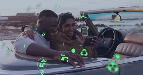 Couple Enjoying Coastal Drive with Eco-Friendly Icons in Convertible