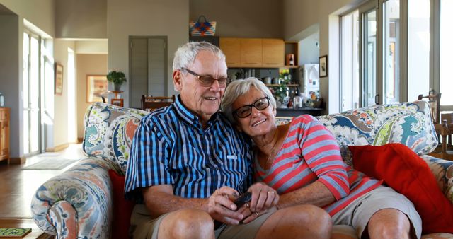 Senior Couple Sitting on Sofa in Cozy Living Room - Download Free Stock Images Pikwizard.com