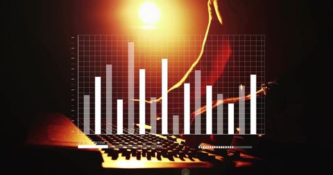 Backlit dj mixing on console with laptop keyboard and bar chart overlay under spotlight