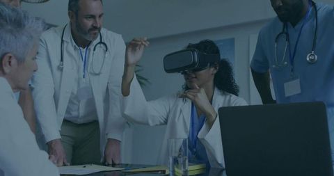 Medical team using virtual reality for clinical training and simulation in hospital room