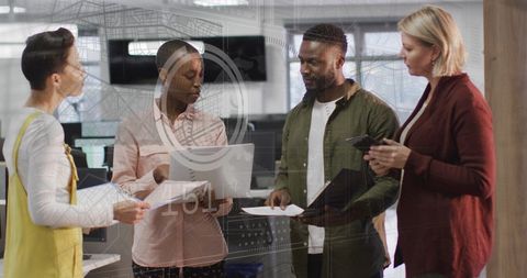 Diverse Team Collaborating on Financial Data in Modern Office - Download Free Stock Images Pikwizard.com