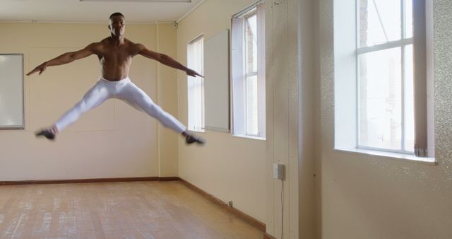 Ballet Dancer Mid-Jump in Studio - Download Free Stock Images Pikwizard.com