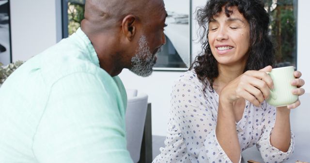 Smiling African American Man and Mixed Race Woman Enjoying Coffee at Home - Download Free Stock Images Pikwizard.com