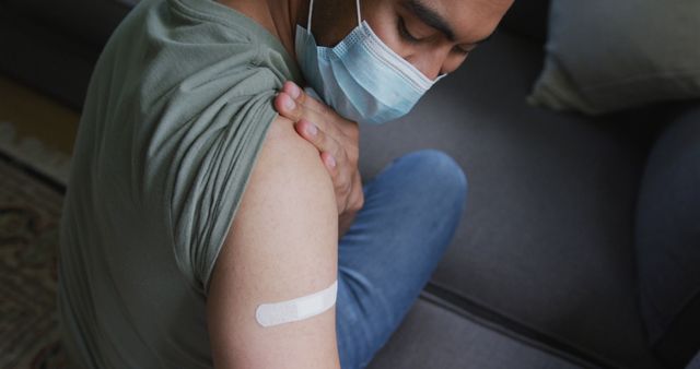 Person Receiving Vaccine with Bandage in Living Room - Download Free Stock Images Pikwizard.com