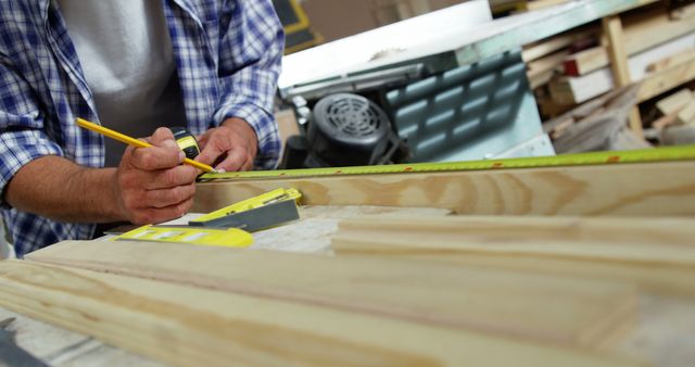 Carpenter Measuring Wood Plank in Workshop - Download Free Stock Images Pikwizard.com