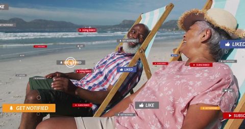 Elderly couple relaxing on beach lounging with smartphones