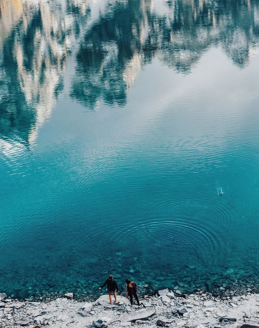 Two Hikers Enjoying Scenic Alpine Lake - Download Free Stock Images Pikwizard.com