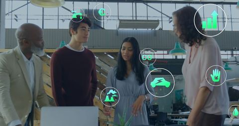 Diverse team discussing innovative business solutions with digital icons