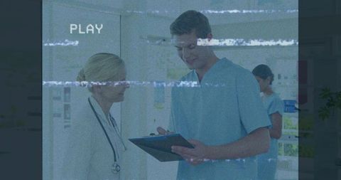 Medical professionals consult with digital monitor effect