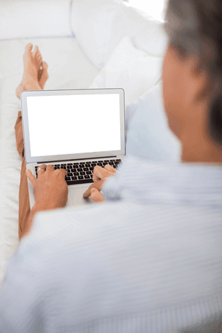 Person relaxing at home with transparent laptop screen