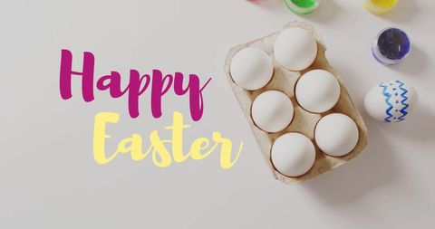 Easter greeting with painted eggs and colorful text
