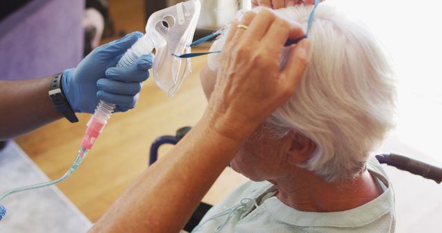 Elderly woman receiving respiratory support from nurse at home illustrates healthcare and elderly care scenarios. Useful for websites, brochures relating to home healthcare, elder care service promotions, and medical training materials.