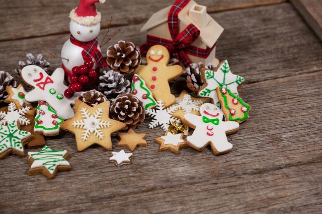 Festive Christmas Cookies with Decorations on Wooden Surface - Download Free Stock Photos Pikwizard.com