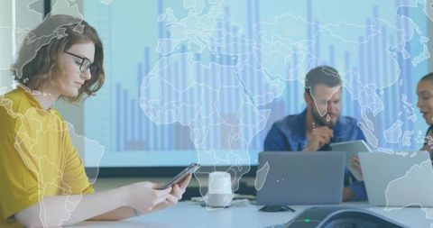 Woman checking smartphone during business meeting with global analytics overlay