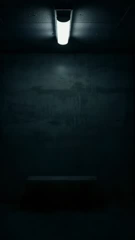 Flickering Fluorescent Light Revealing Empty Bench in Concrete Room Vertical Video