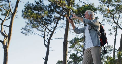 Man Photographing Nature on Outdoor Solo Adventure - Download Free Stock Images Pikwizard.com