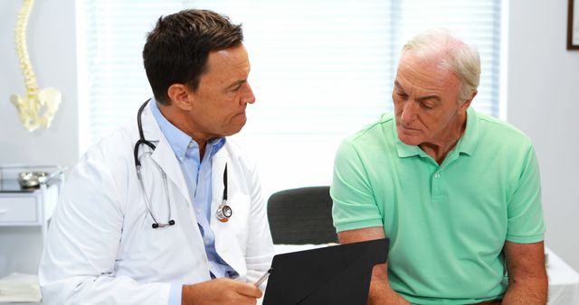 Doctor Consulting Senior Male Patient in Clinical Setting - Download Free Stock Images Pikwizard.com