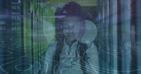 It technician with virtual graphics monitors data in server room