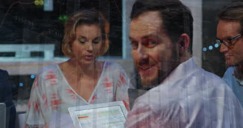 Business Professionals Using Tech with Data Overlay