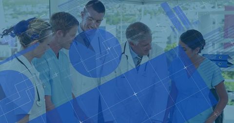 Healthcare team reviewing patient information with digital technology overlay