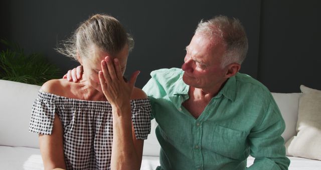 Portrait of caucasian senior woman crying while her husband supporting her at home - Download Free Stock Photos Pikwizard.com