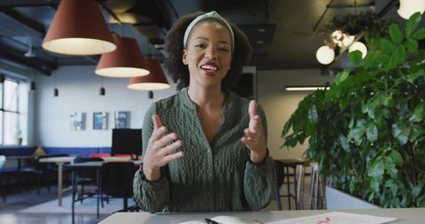 Confident Professional Woman Engaging in Office Presentation