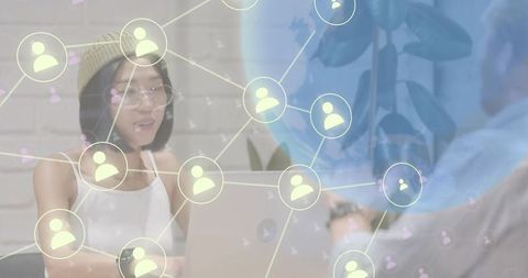 Asian woman typing on laptop in coworking space with digital network overlay for remote work