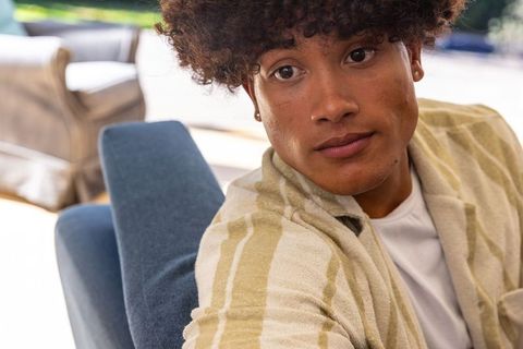 Young Man Relaxing in Sunny Outdoor Setting