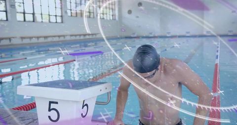 Swimmer in Competitive Pose at Indoor Pool