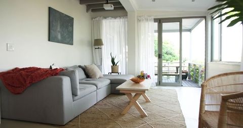 Modern minimalist living room with cozy grey sectional sofa