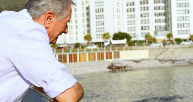 Elderly Man Reflecting by Waterfront Cityscape - Download Free Stock Images Pikwizard.com